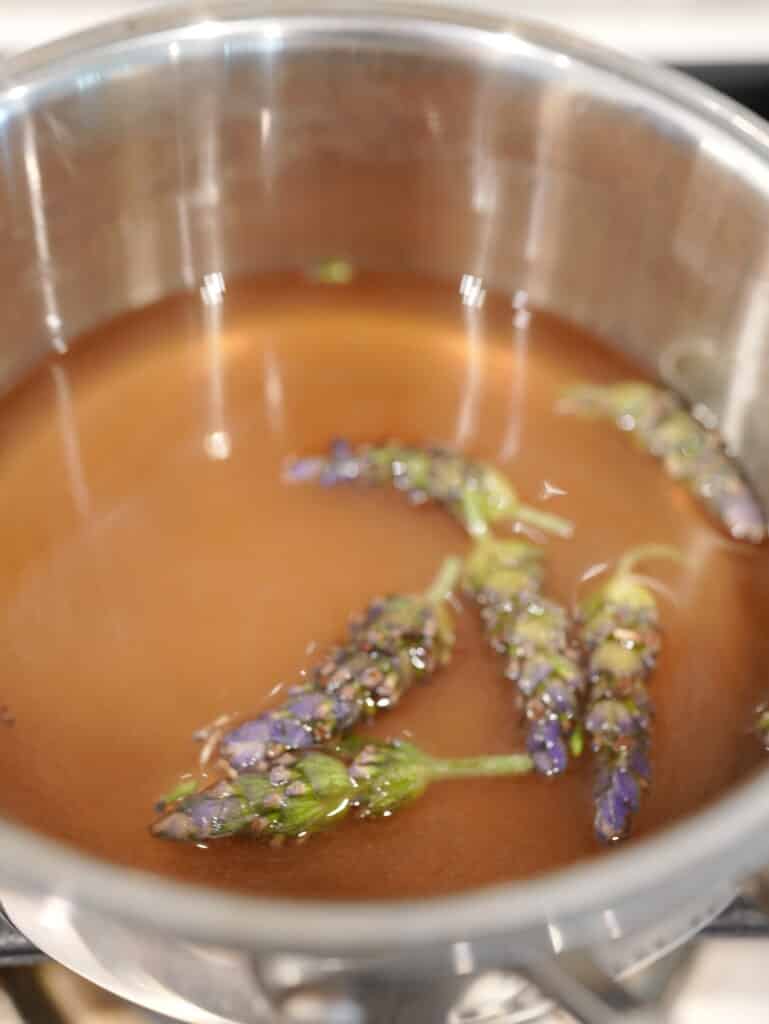 Pot filled with lavender blooms and syrup