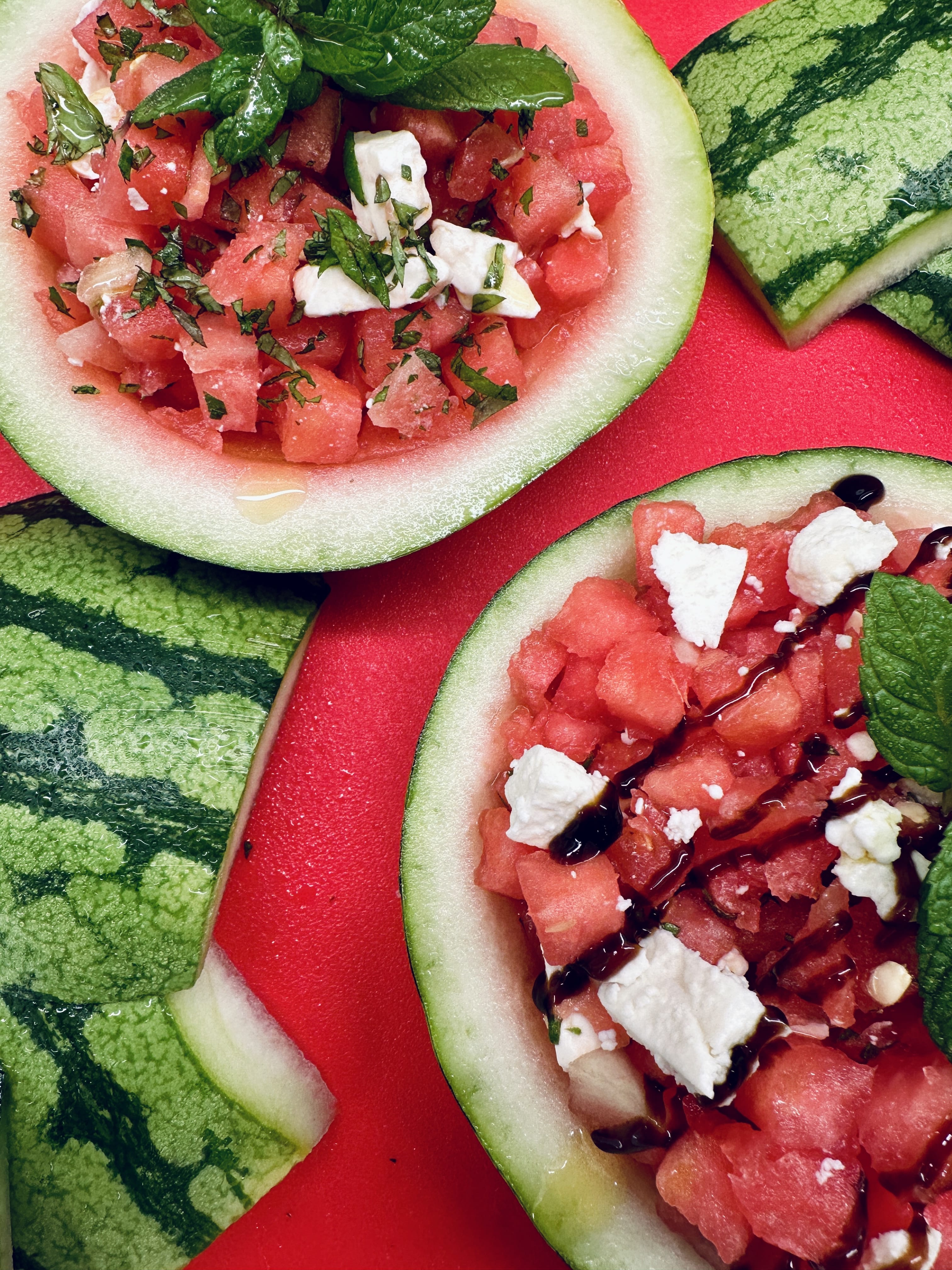 Watermelon, Mint and Feta salad served inside halved watermelon husks
